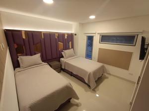 Ένα ή περισσότερα κρεβάτια σε δωμάτιο στο New Hotel Vip