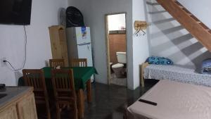 a small room with a kitchen and a room with a table at La morocha in Camba Punta