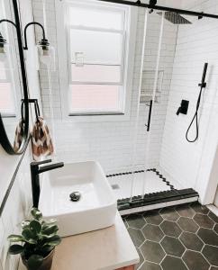 a white bathroom with a sink and a shower at Garden Oasis 3BR 15 min FIFA World Cup MetLife Std in Harrison +54 photos