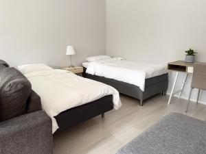 En eller flere senge i et værelse på Lägenhet nära Isaberg Hestra