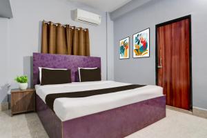 Ένα ή περισσότερα κρεβάτια σε δωμάτιο στο Hotel O Palasuni Bridge Bhubaneswar Formerly Ganpat +21 φωτογραφίες