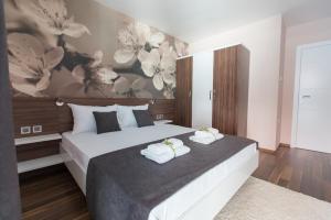 Postel nebo postele na pokoji v ubytování Garni Hotel Niš City View