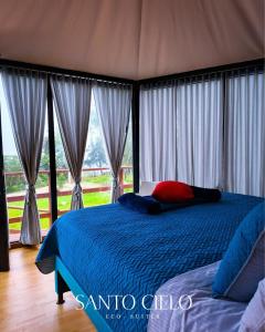 Postel nebo postele na pokoji v ubytování Glamping Santo Cielo