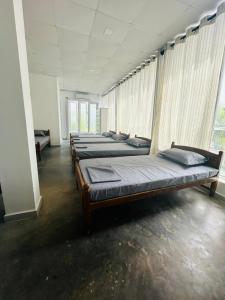 Ένα ή περισσότερα κρεβάτια σε δωμάτιο στο Colombo Mount Hostel