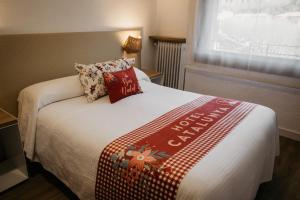 Una cama o camas en una habitación de Hotel Catalunya Ribes de Freser