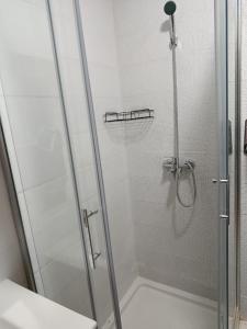a shower with a glass door in a bathroom at Brand new apartment in Sport city Tangier in Tangier