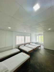 Ένα ή περισσότερα κρεβάτια σε δωμάτιο στο Colombo Mount Hostel