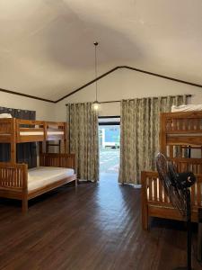 Ένα ή περισσότερα κρεβάτια σε δωμάτιο στο Villa Bella 3 Beach Resort