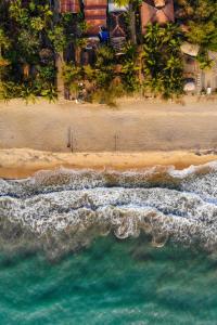 an aerial view of a beach and the ocean at Femingo by Costels in Hiriketiya