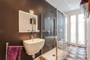 a bathroom with a sink and a shower and a tub at Ippolito - Free WiFi & Air Conditioning in Faenza +14 photos