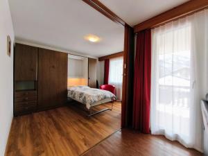 Ένα ή περισσότερα κρεβάτια σε δωμάτιο στο Haus Primavera