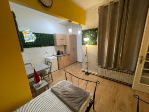 a living room with a couch and a kitchen at Downtown-Room Zagreb in Zagreb +4 photos