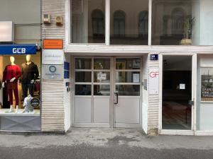 a store front with the doors of a building at Downtown-Room Zagreb in Zagreb