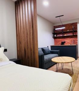 a bedroom with a bed and a couch at Skyheaven, new gudauri in Gudauri