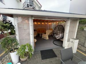 a porch of a house with a patio at Willa Atlantis in Mielno