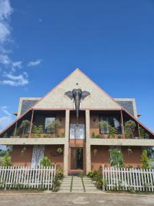 a house with an elephant on the front of it at Aura Kabini by Tripture in Begūr