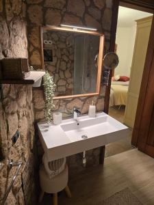 a bathroom with a sink and a mirror at Tenuta Oliva in Fisciano +75 photos