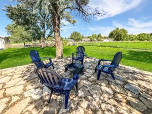 a group of blue chairs sitting on a patio at Walker Ridge in Montrose