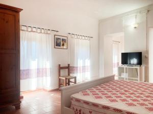 Ένα ή περισσότερα κρεβάτια σε δωμάτιο στο Domo Sa Bellesa