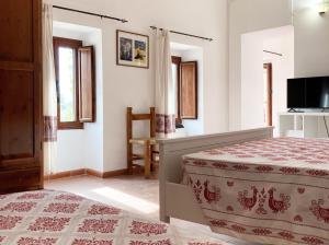 Ένα ή περισσότερα κρεβάτια σε δωμάτιο στο Domo Sa Bellesa +7 φωτογραφίες