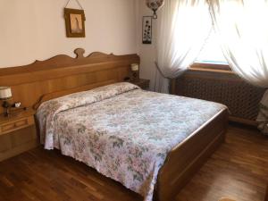 Ένα ή περισσότερα κρεβάτια σε δωμάτιο στο Appartamento Croda