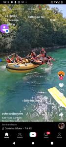 a group of people on a raft in the water at Camp Apartmani Tara in Pljevlja