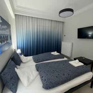 Postel nebo postele na pokoji v ubytování Serres city center modern apartment (Monika)