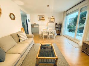 a living room with a couch and a table at Casa Branca Cantabria in Cuchia +16 photos