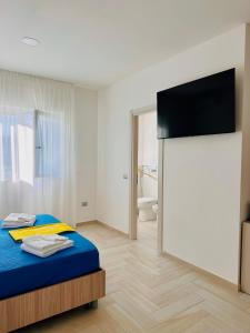 Ένα ή περισσότερα κρεβάτια σε δωμάτιο στο MareLuna - Your home by the sea +81 φωτογραφίες