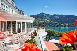 a hotel with a view of the lake and mountains at Grand Hotel Zell am See in Zell am See