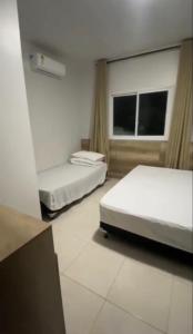 Ένα ή περισσότερα κρεβάτια σε δωμάτιο στο Casa Maresia Ponta da Asa