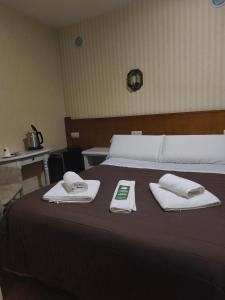 Una cama o camas en una habitación de Hostal Tic-Tac