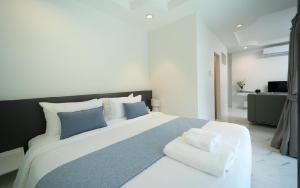 Ένα ή περισσότερα κρεβάτια σε δωμάτιο στο Brickotel Naithon Beach