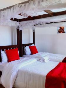 Ένα ή περισσότερα κρεβάτια σε δωμάτιο στο Hatupe