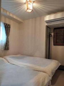 Giường trong phòng chung tại 源氏民宿 +5 ảnh