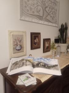 a book sitting on top of a table at Villa Rosa in Acqualagna