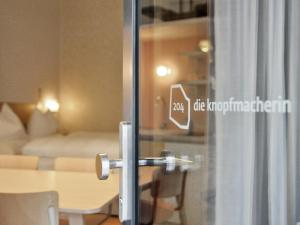 Postel nebo postele na pokoji v ubytování grätzlhotel Karmelitermarkt
