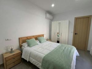 En eller flere senge i et værelse på Écija Confort by Casa Yaye