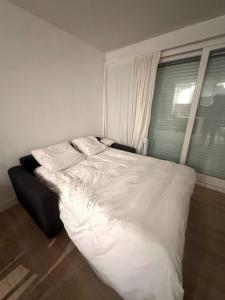 Ένα ή περισσότερα κρεβάτια σε δωμάτιο στο Le Baulnéaire, Vue Mer, Plage à Pied, Parking Privé