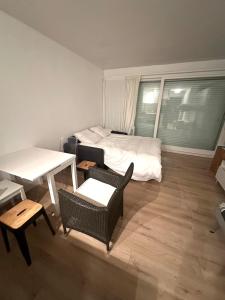 Ένα ή περισσότερα κρεβάτια σε δωμάτιο στο Le Baulnéaire, Vue Mer, Plage à Pied, Parking Privé