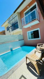 Bazén v ubytování Casa Premium Paraty com Piscina Aquecida e Passeio de Escuna de Cortesia incluso nebo v jeho okolí