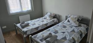 Ένα ή περισσότερα κρεβάτια σε δωμάτιο στο Gîte La Bracilienne