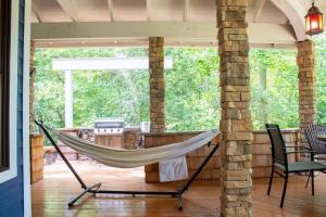 a hammock on the porch of a house at Creekside Haven with Dock & Scenic Views in Hollywood