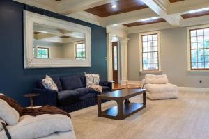 a living room with a couch and a table at Creekside Haven with Dock & Scenic Views in Hollywood +22 photos