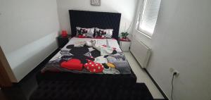 Giường trong phòng chung tại Princeza apartman