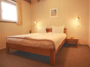 Postel nebo postele na pokoji v ubytování skandinavisches Ferienhaus in Mirow