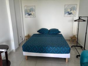 Ένα ή περισσότερα κρεβάτια σε δωμάτιο στο Les locations de Miche