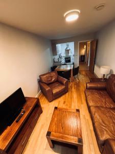 a living room with a couch and a table at Annebrook House Hotel in Mullingar