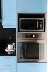 Η κουζίνα ή μικρή κουζίνα στο Fão Apart Vacation Apartments