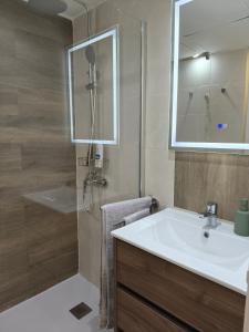 a bathroom with a sink and a shower at Dreams Castle in Los Cristianos +27 photos
